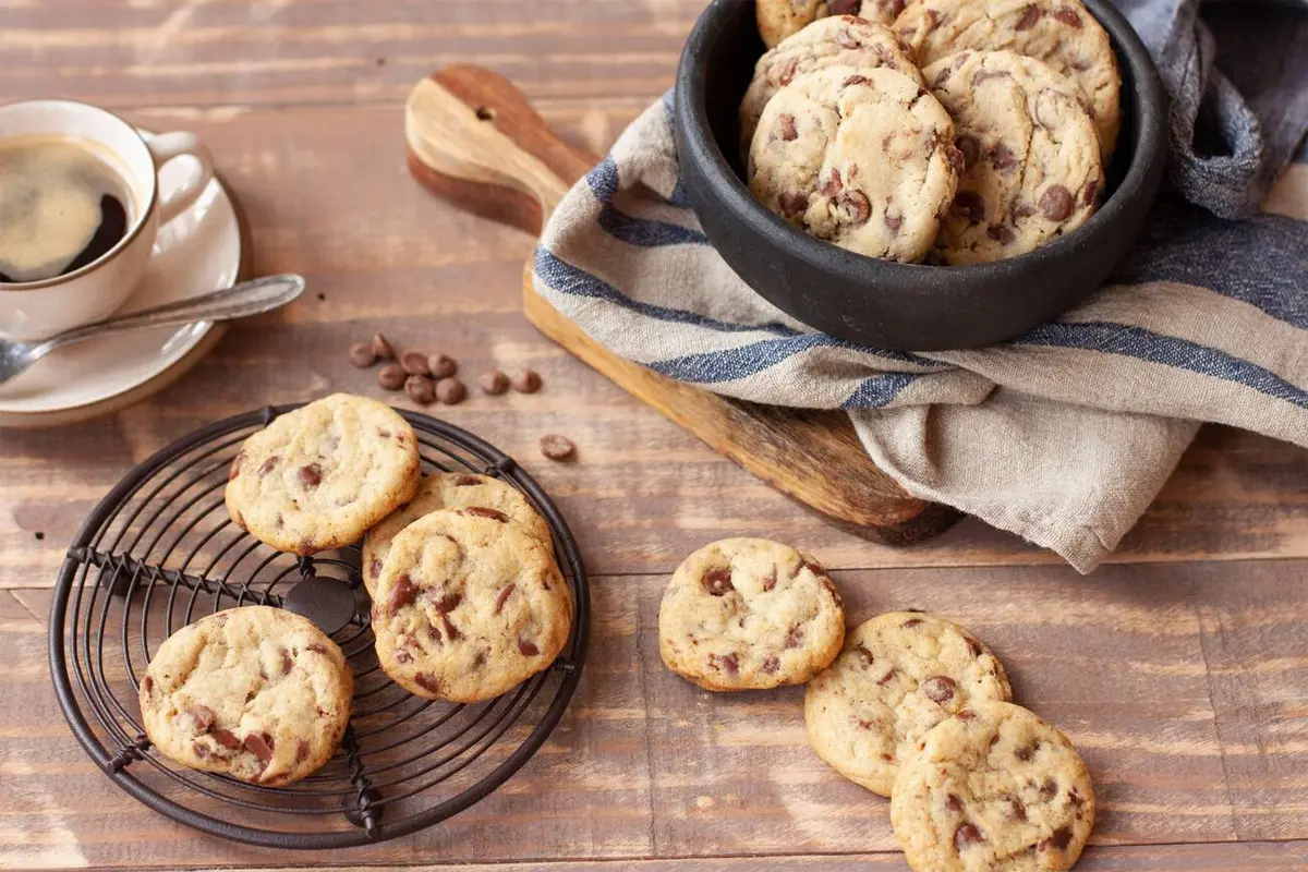 Ingredients for chocolate chip cookies laid out on a table