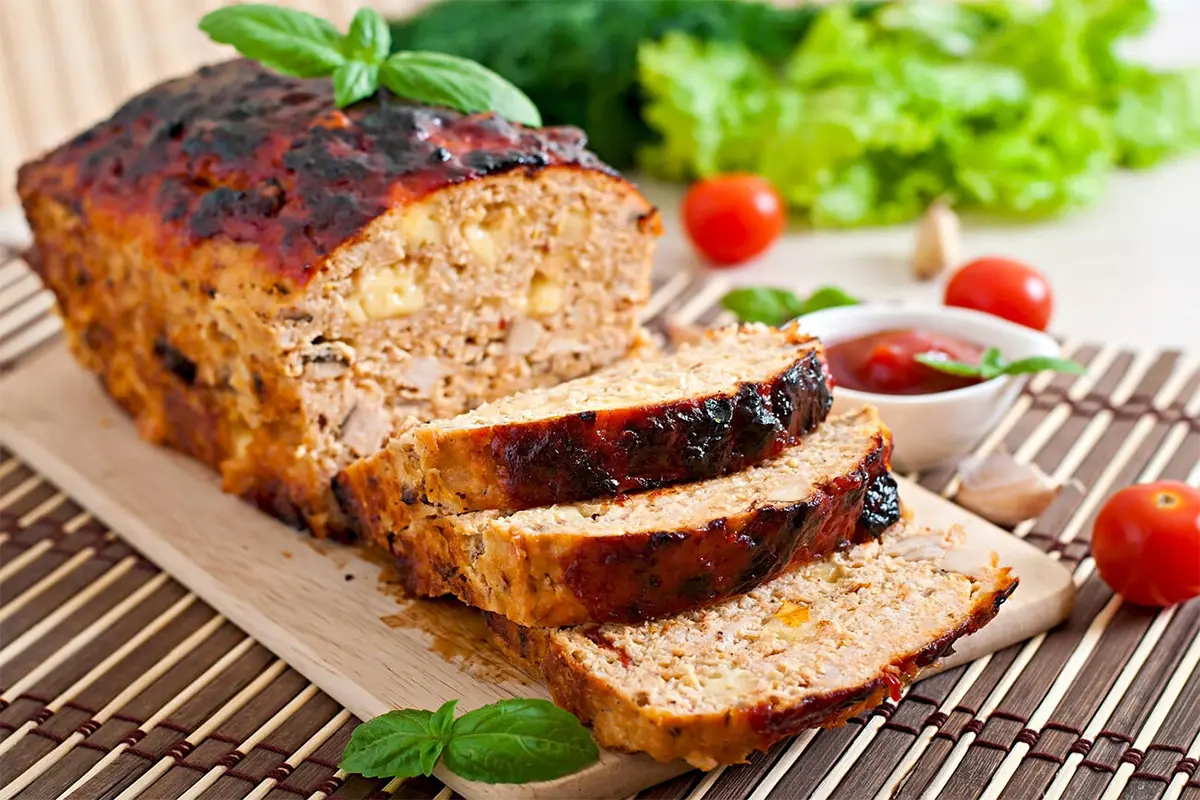 Elegant rustic dinner table setting with meatloaf