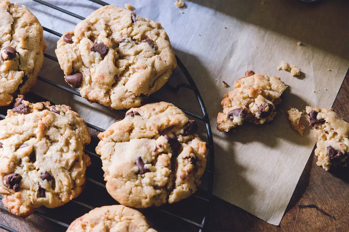 Cookie ingredients and baking tools spread on a kitchen counter