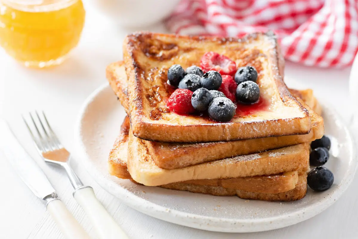 Gourmet French toast served with berries and syrup