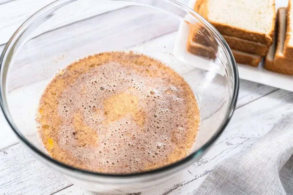 A top view of French toast served on a beautifully set breakfast table