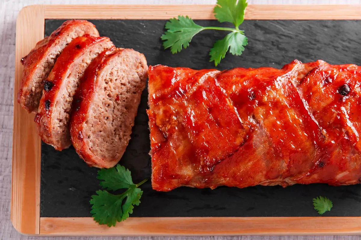 Ingredients being mixed for preparing meatloaf