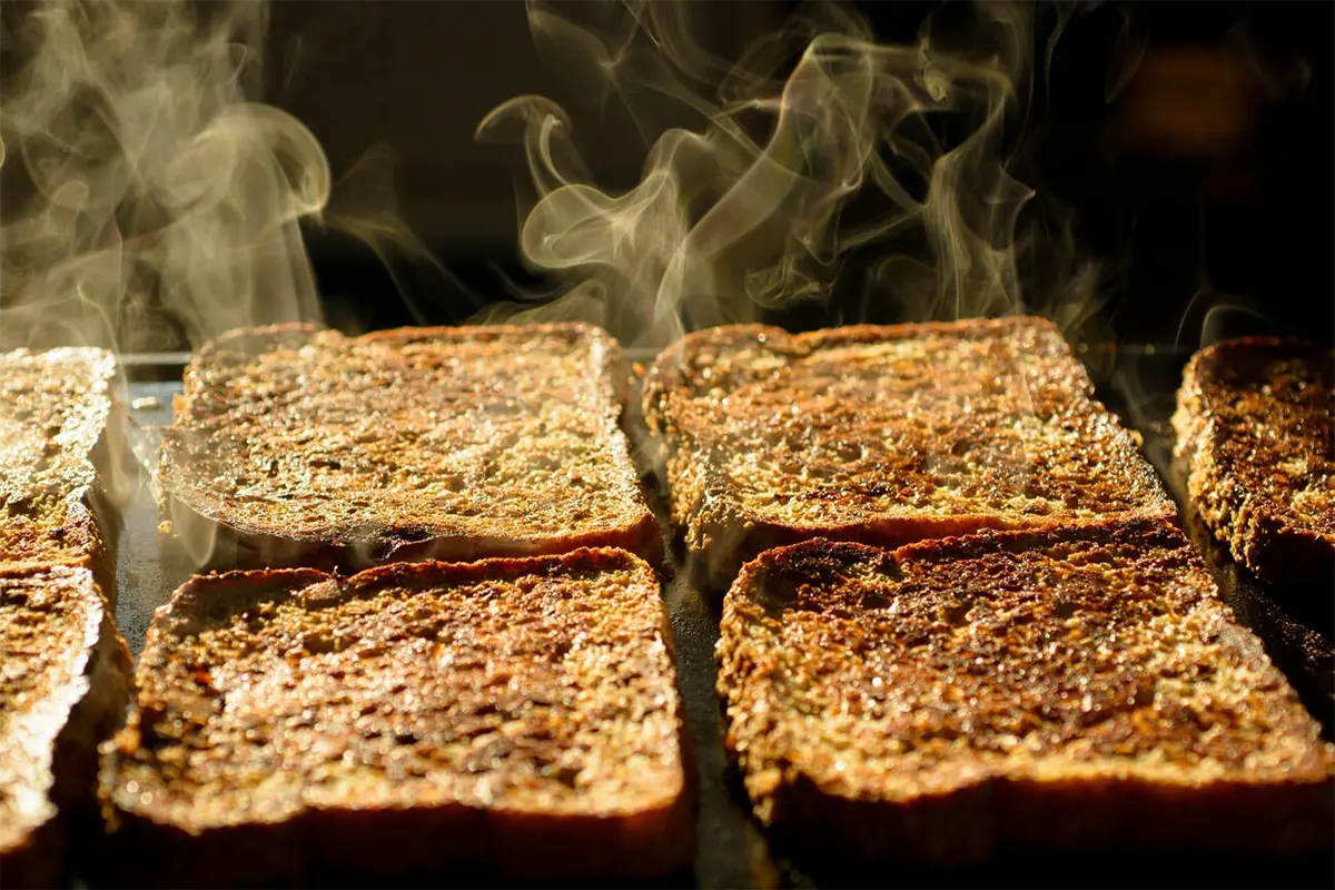 Preparing French toast in a modern kitchen setting