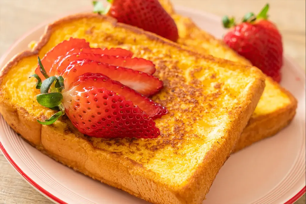 Gourmet French toast served with berries and syrup