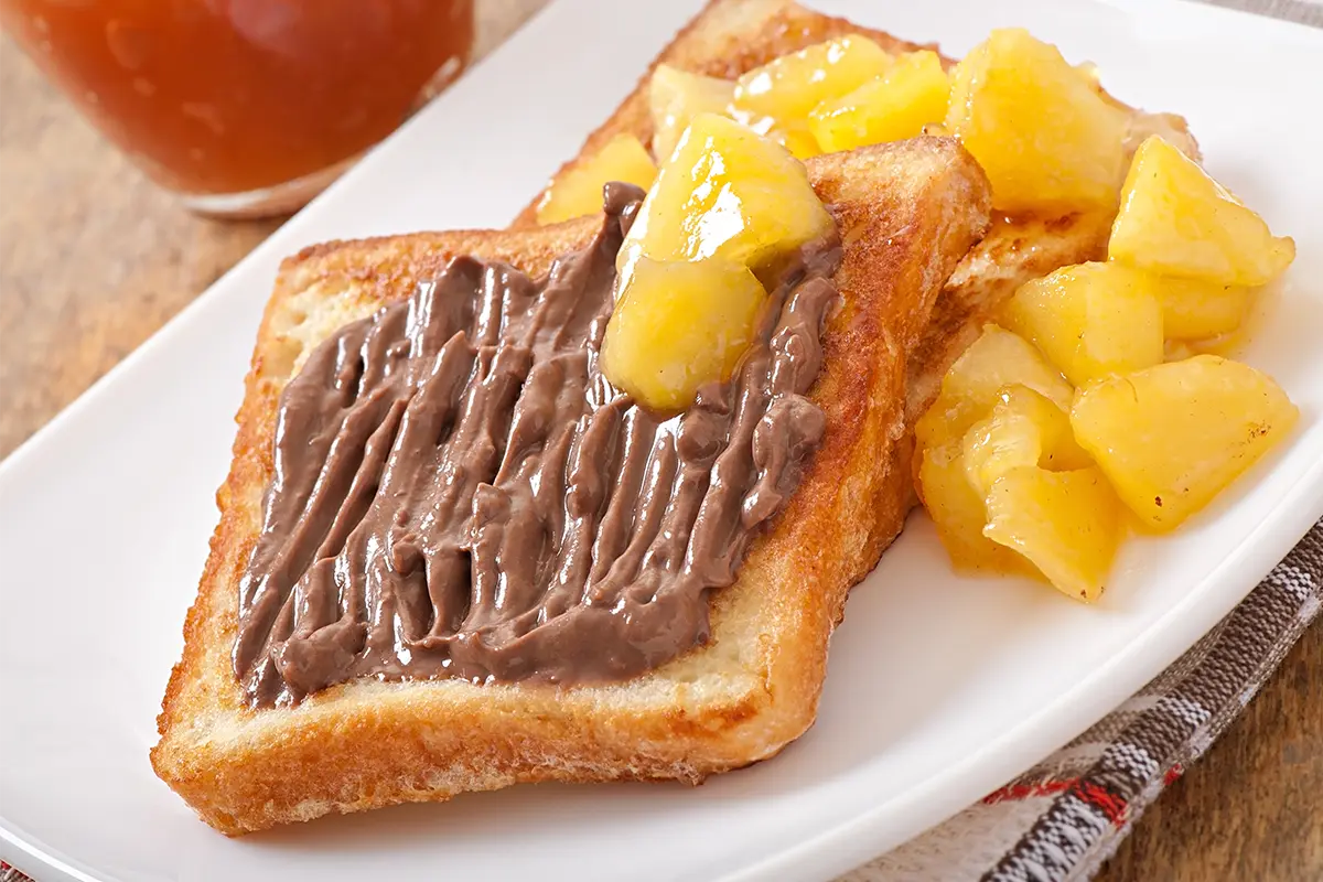 Chef preparing French toast in a professional kitchen